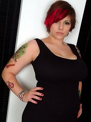 Tattooed British alt girl Dors in tight black dress plays with her pussy